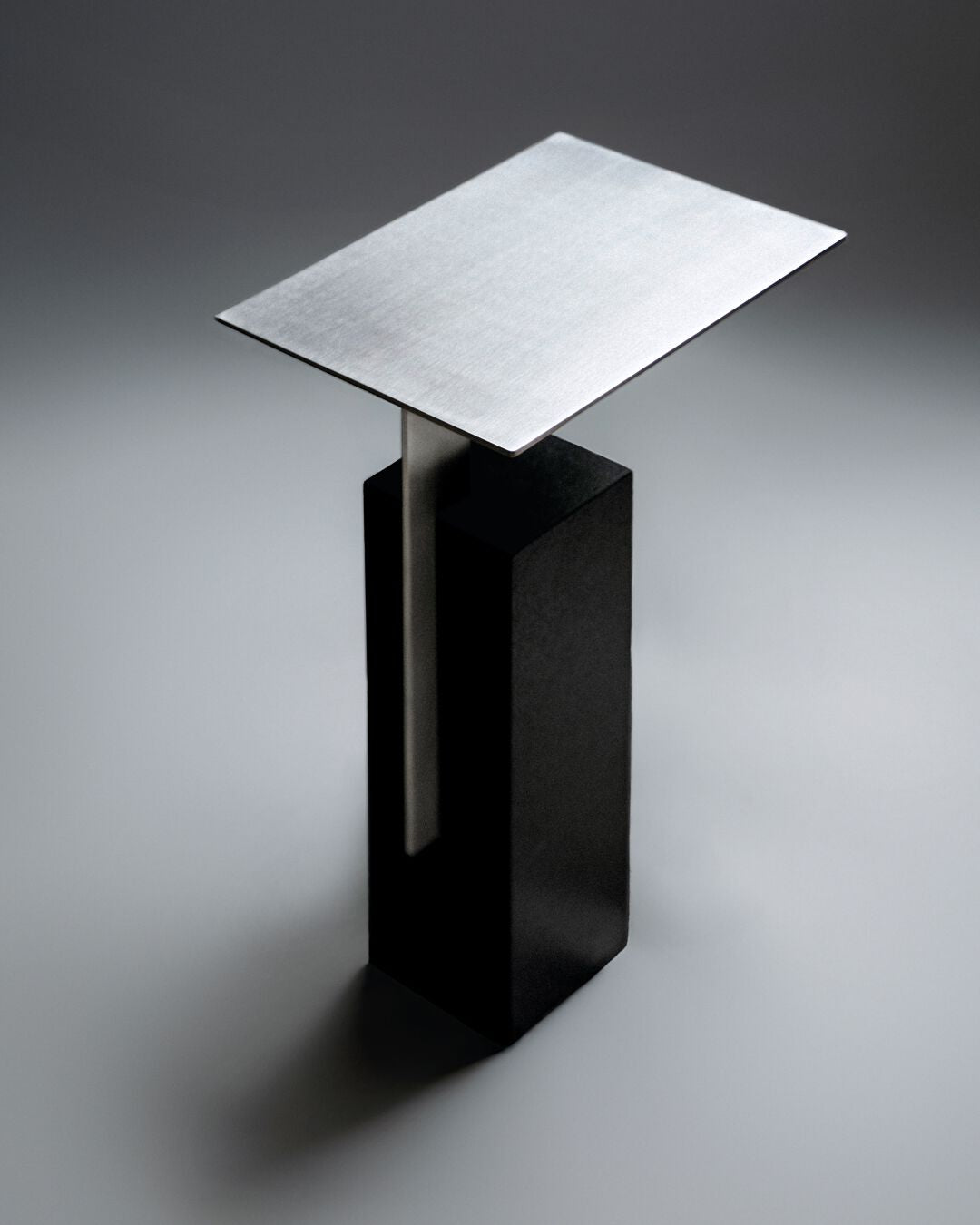 MONO Side table with travertine base and metal top